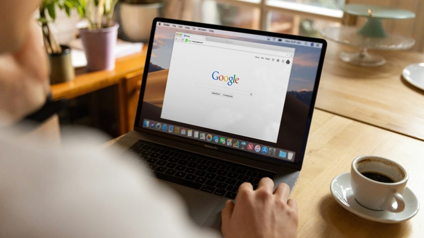 How to Find Profitable Dropshipping Niches Google Keyword Planner and Ahrefs A person sitting in front of a laptop with Google turned on.
